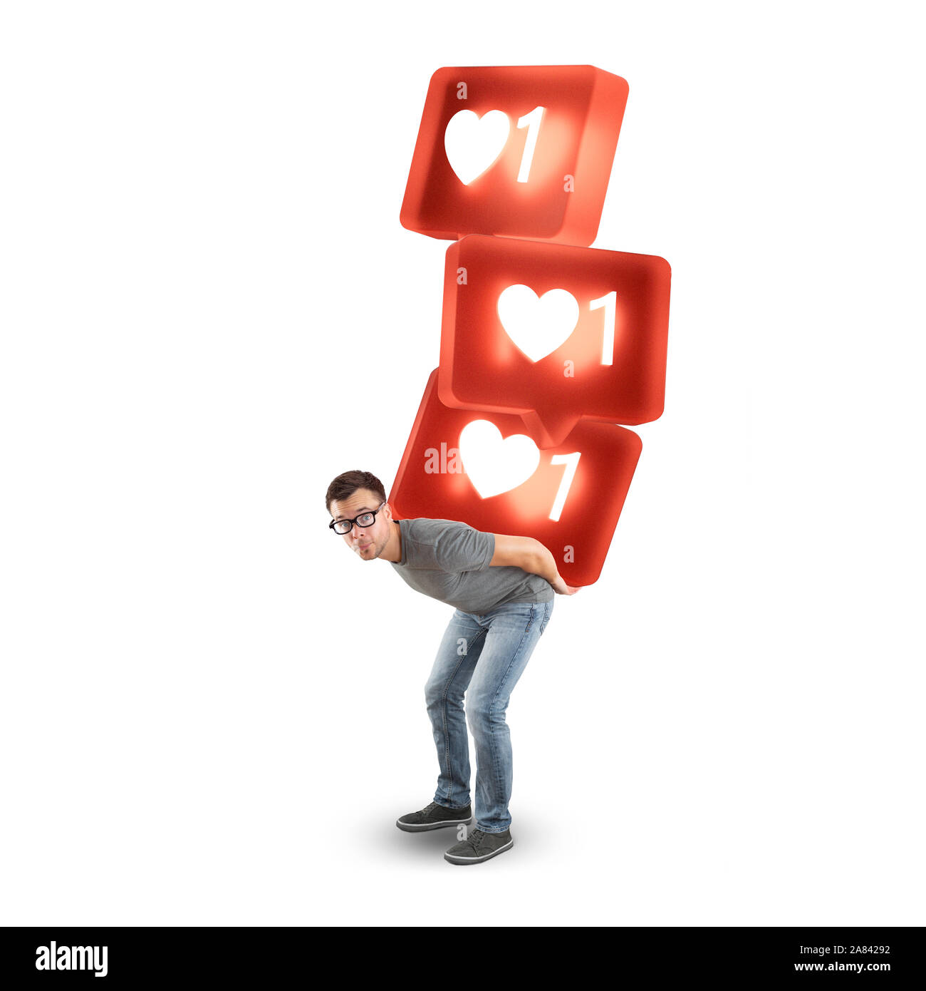 Uomo che porta una pila di grandi social media come simboli - isolato su bianco Foto Stock