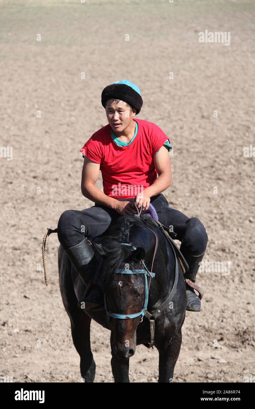 Buzkashi horseman in Kirghizistan Foto Stock