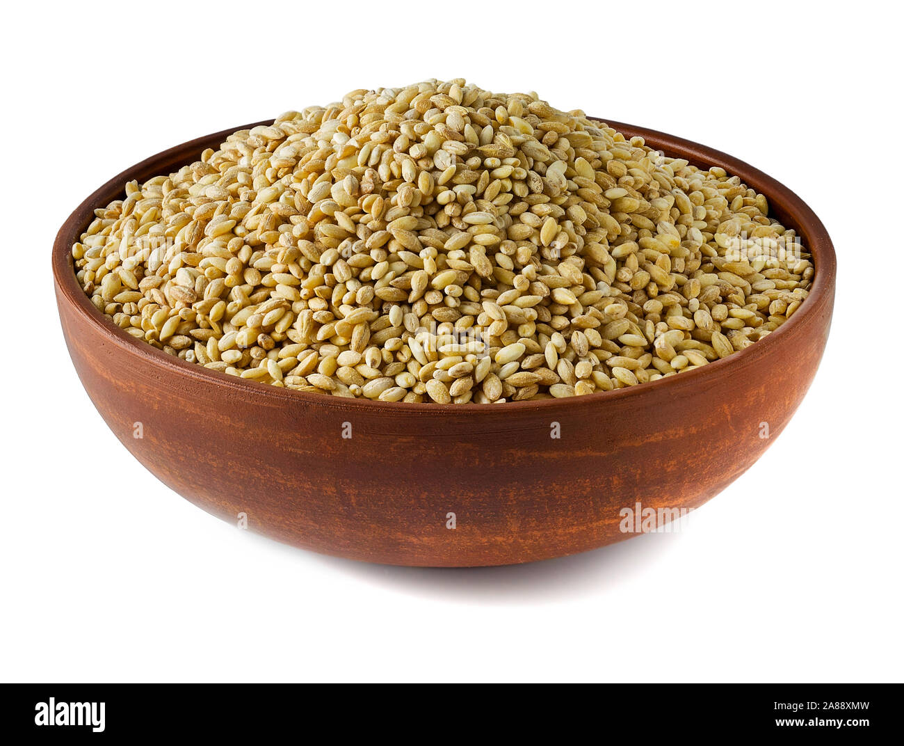 Attraente piastra di argilla in cui il grano è collocato per preparare una varietà di prodotti Foto Stock Attraente piastra di argilla in cui il grano è collocato per preparare una varietà di prodotti Foto Stock