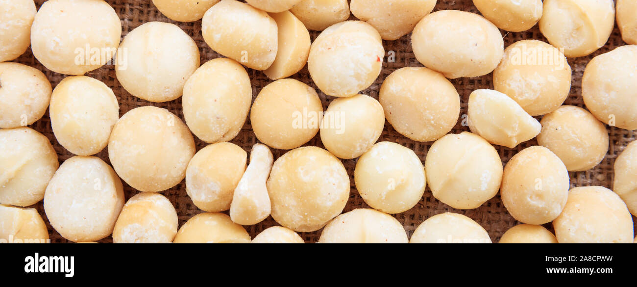 I dadi Macadamias piena texture di sfondo, banner, vista dall'alto, Foto Stock