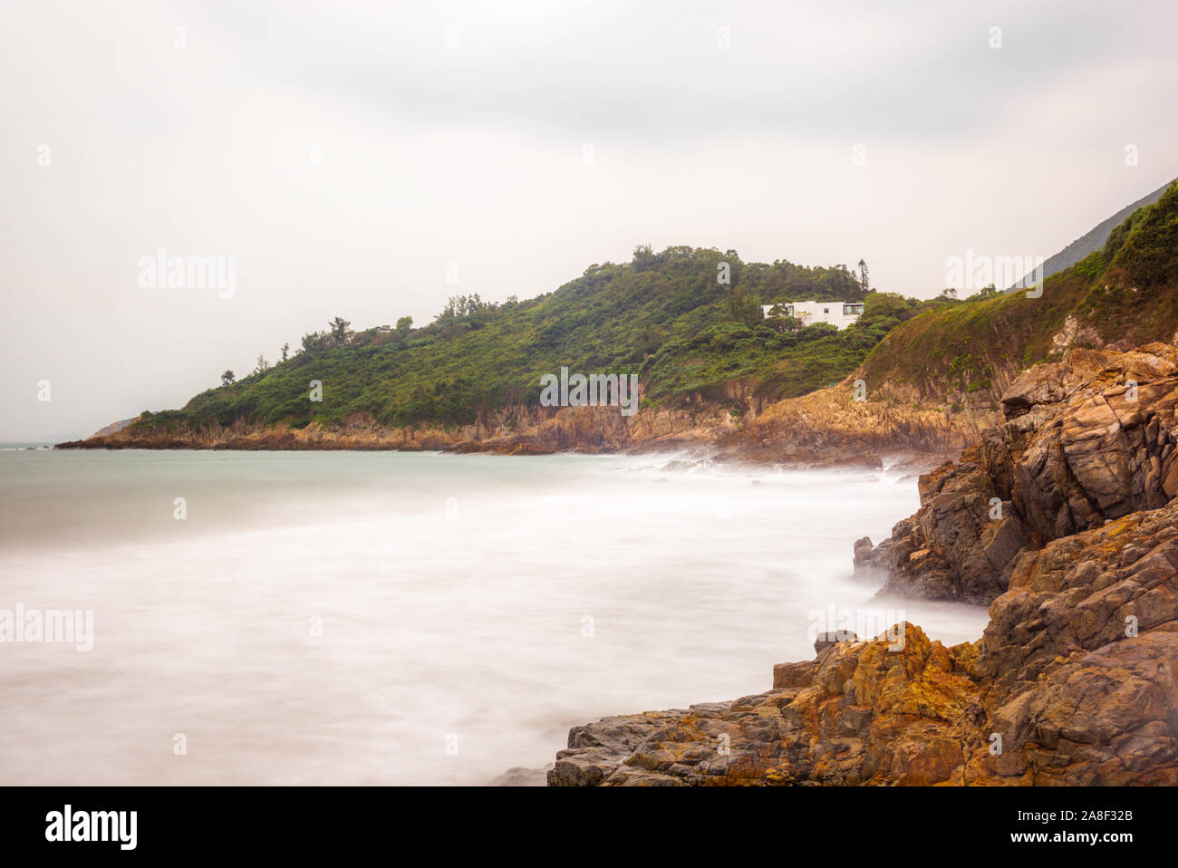 Il seascape delle rocce e spiaggia a grande onda Beach a Hong Kong presso sunrise - 1 Foto Stock