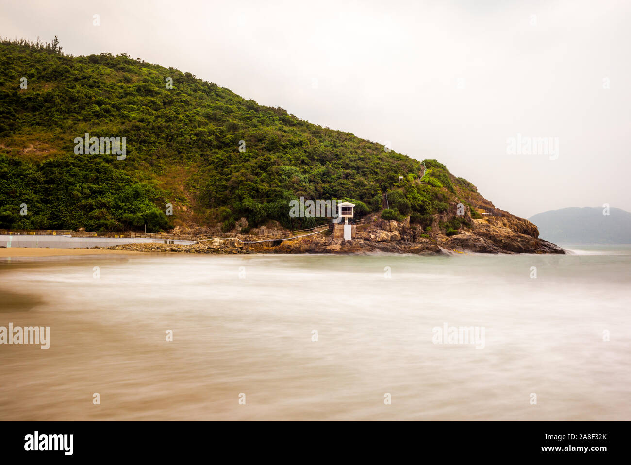 Il seascape delle rocce e spiaggia a grande onda Beach a Hong Kong presso sunrise - 11 Foto Stock