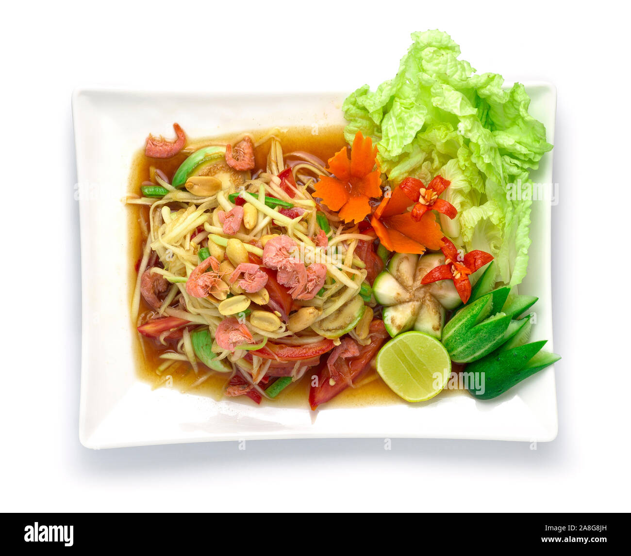 La papaia insalata piccante decapato in salsa di pesce il cibo thai piccante antipasto di stile popolare della Thailandia decorare con sculture di verdure e goodtasty goodfoo Foto Stock