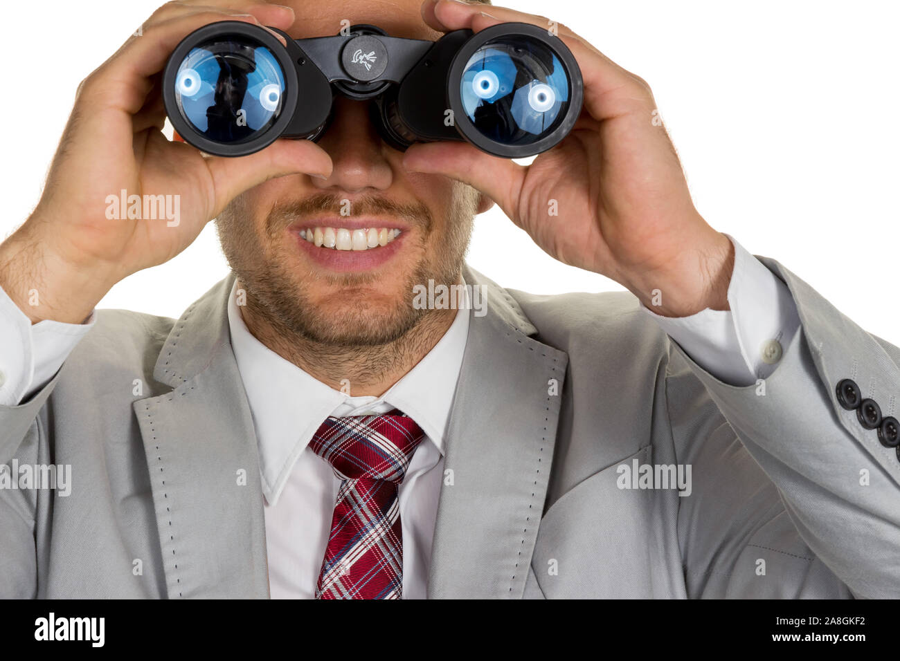 Ein Manager ( Jungunternehmer ) mit Fernglas auf der Suche nach Aufträgen oder posti di lavoro Foto Stock