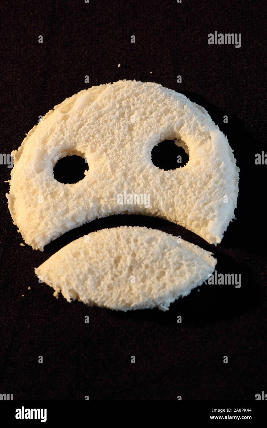 Fetta di pane triste faccia infelice Foto Stock
