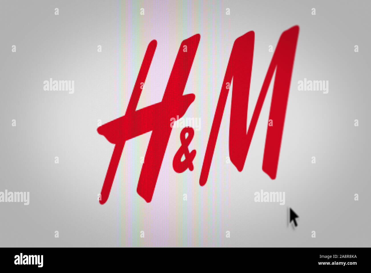 Logo della società pubblica Hennes & Mauritz visualizzata sullo schermo di un computer in close-up. Credito: PIXDUCE Foto Stock
