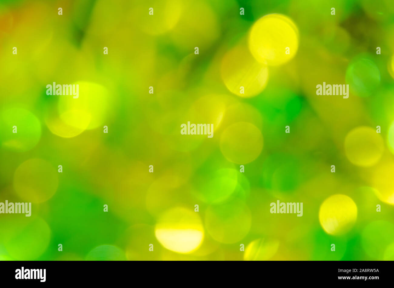 Abstract sfocato giallo e verde bokeh sullo sfondo Foto Stock
