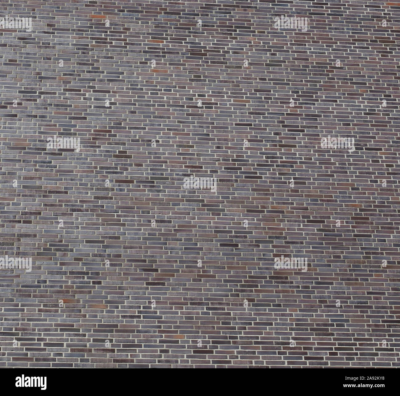 Rosso scuro muro di mattoni utili come uno sfondo Foto Stock