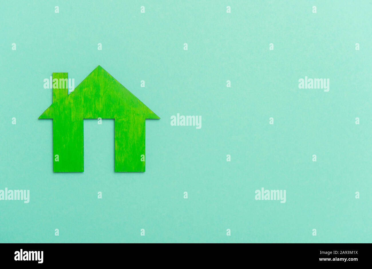 Il simbolo Home su sfondo verde. Home sweet home Foto Stock