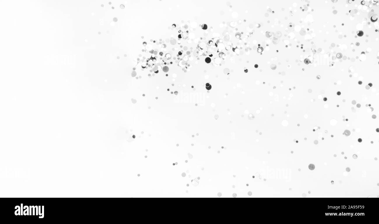 Festosa monocromatico astratta glitter sparkle coriandoli sfondo lucido o invito alla festa di compleanno, Natale design, la caduta neve invernale Foto Stock