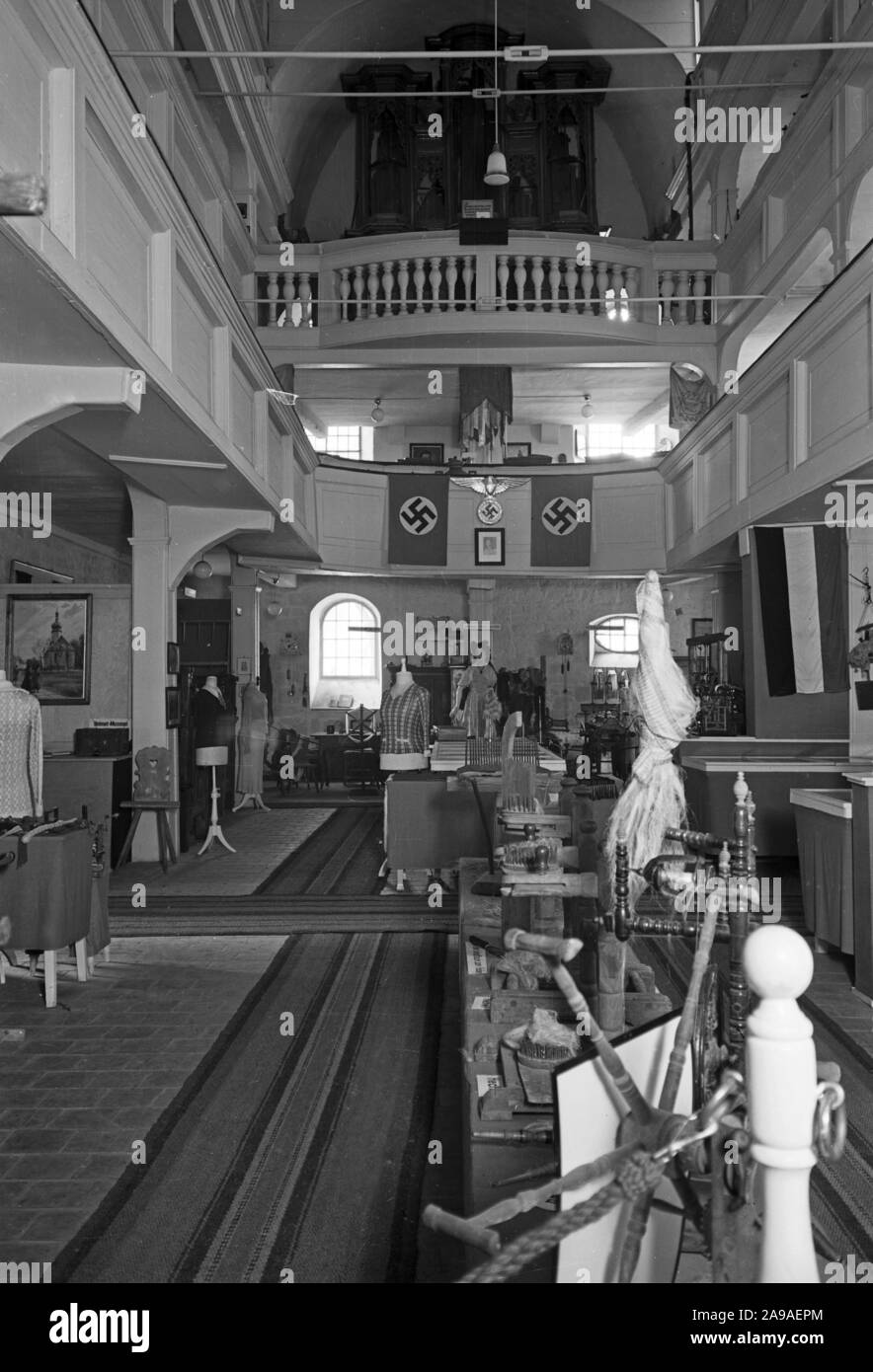 Lavoratore in una tessitura e filatura fabbrica, Germania 1930s. Foto Stock