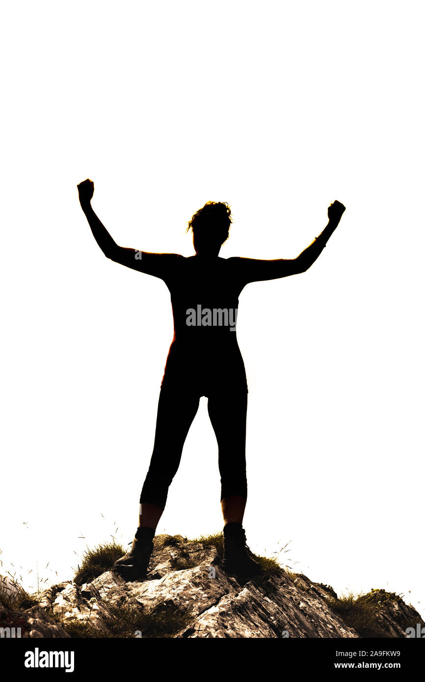 Silhouette femminile in Victor pongono su una roccia di fronte a uno sfondo bianco Foto Stock