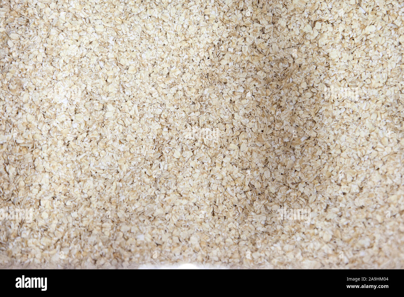 Asciugare le scaglie di fiocchi d'avena il cibo a colazione prima di essere cucinati Foto Stock