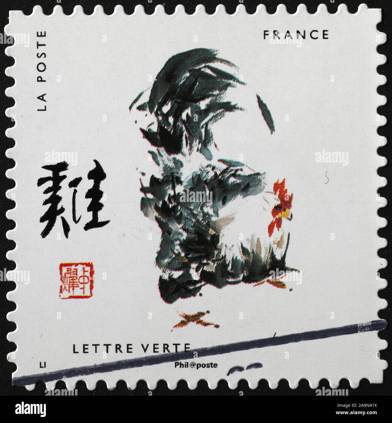 La verniciatura del gallo di zodiaco cinese sul francobollo Foto Stock