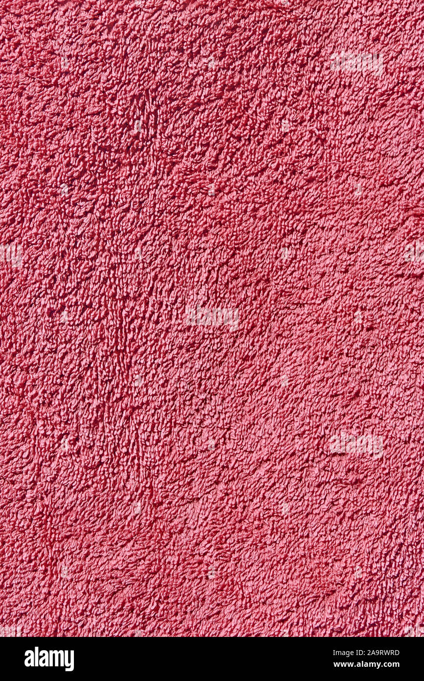Rosa asciugamani in spugna in condizioni di luce solare intensa close-up come una texture Foto Stock