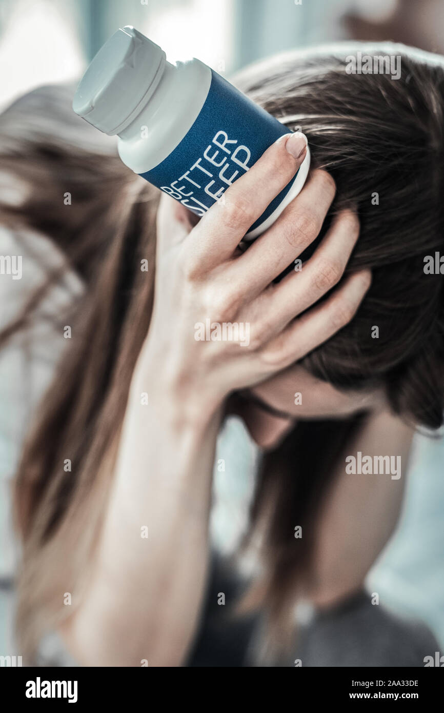 In prossimità di una piccola bottiglia con le pillole Foto Stock