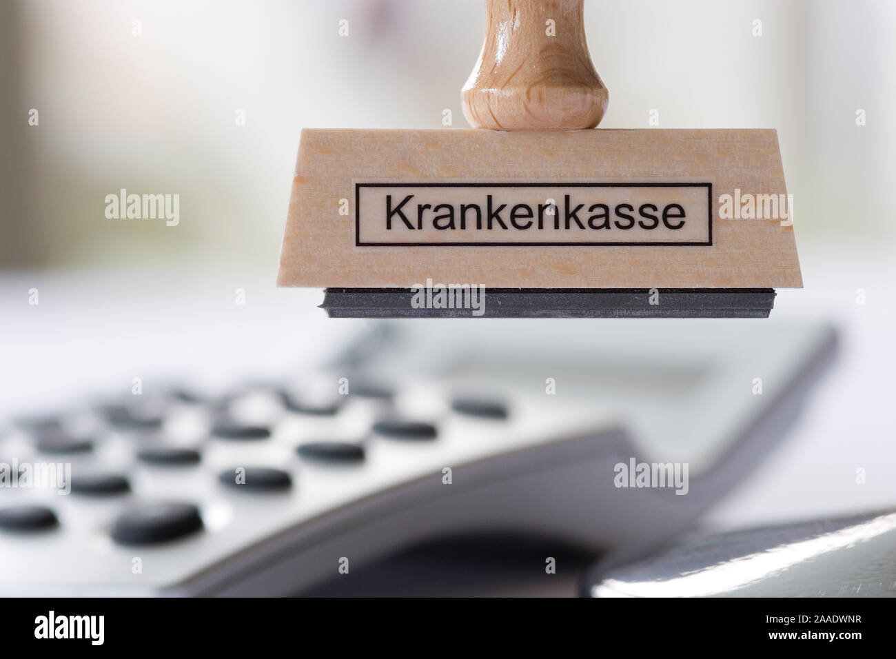 Stempel mit Aufschrift Krankenkasse hängt un Stempelrondell Foto Stock