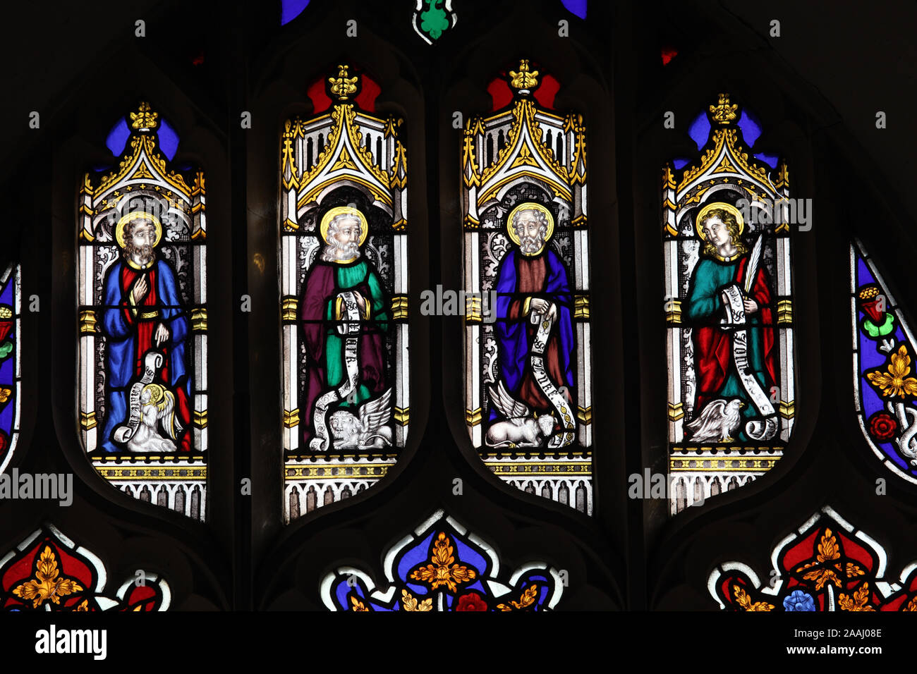 Una vetrata di John Dixon (1849) raffigurante i quattro Evangelisti, la Chiesa di San Michele, Sutton, Norfolk, Inghilterra Foto Stock