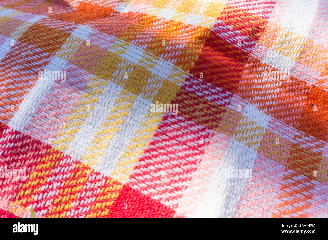 Tovaglia di panno sfondo per pic-nic con colori caldi Foto Stock