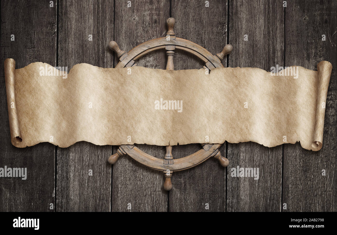 Pirati vecchia mappa scorrere e volante su uno sfondo di legno Foto Stock