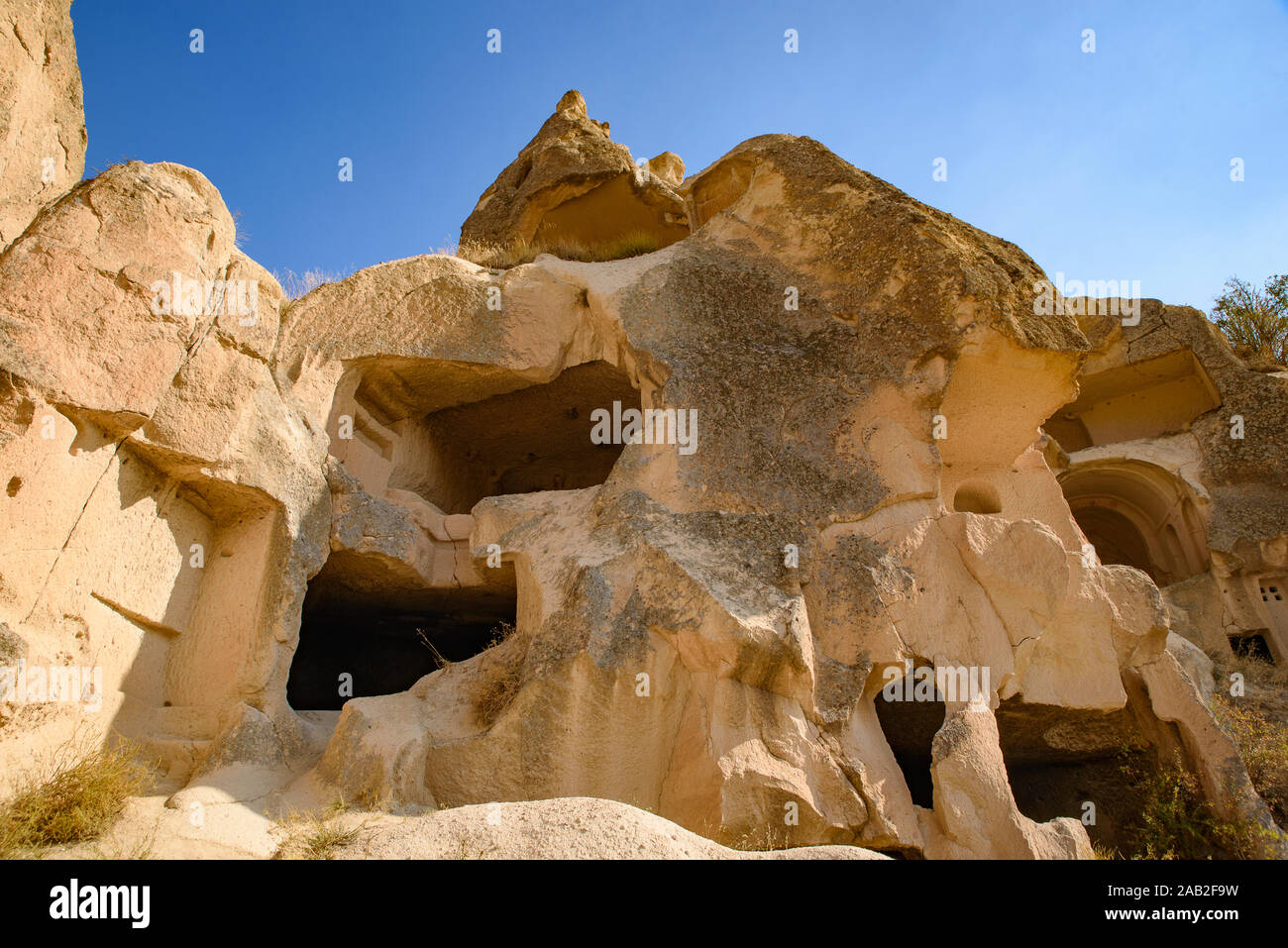 Case di caverne scavate nella pietra di Göreme, Cappadocia, Turchia Foto Stock