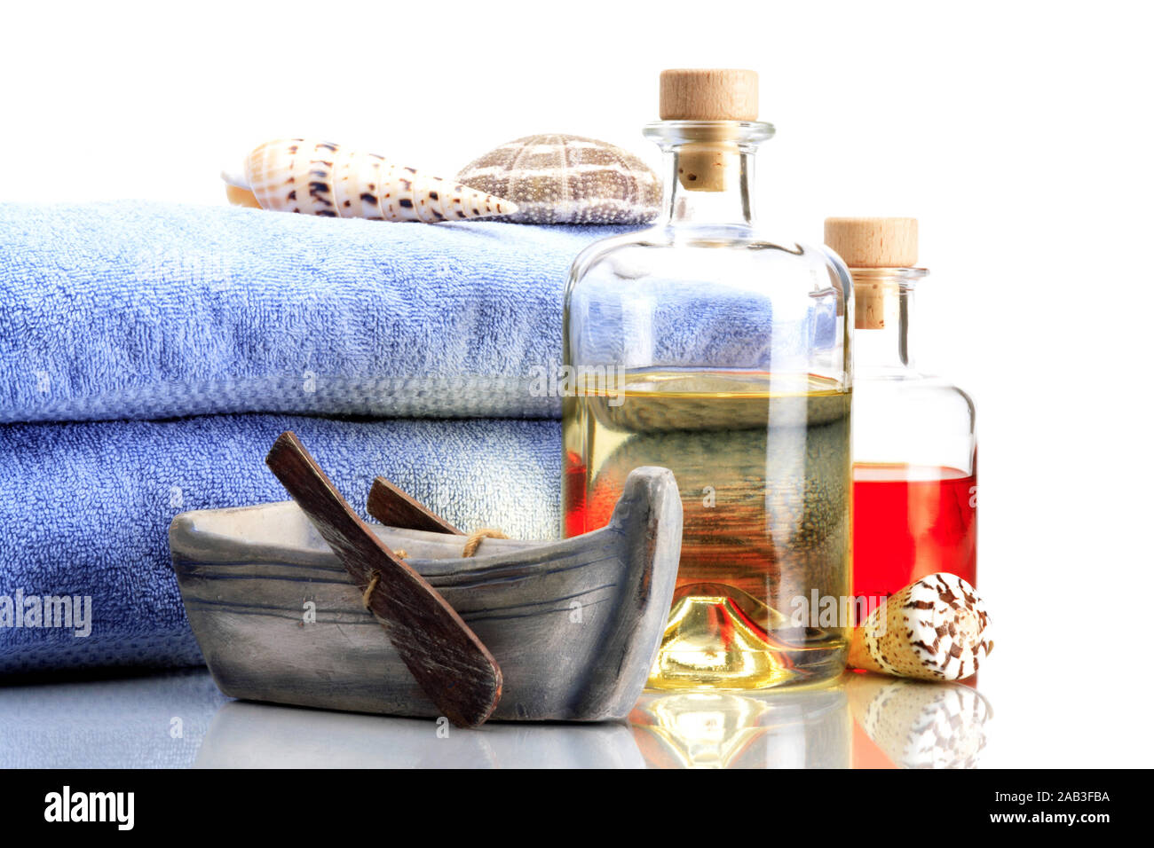 Badeoel mit Handtuecher Foto Stock