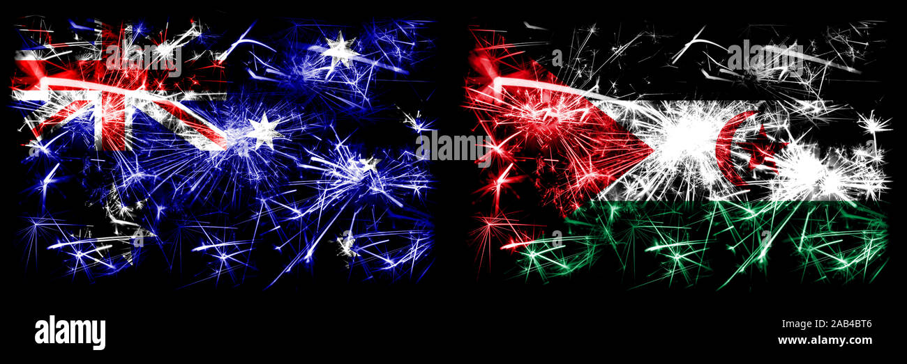 Australia, Ozzie vs sahraoui Anno Nuovo celebration Sparkling fuochi d'artificio concetto flag di sfondo. Combinazione di due stati astratta bandiere. Foto Stock