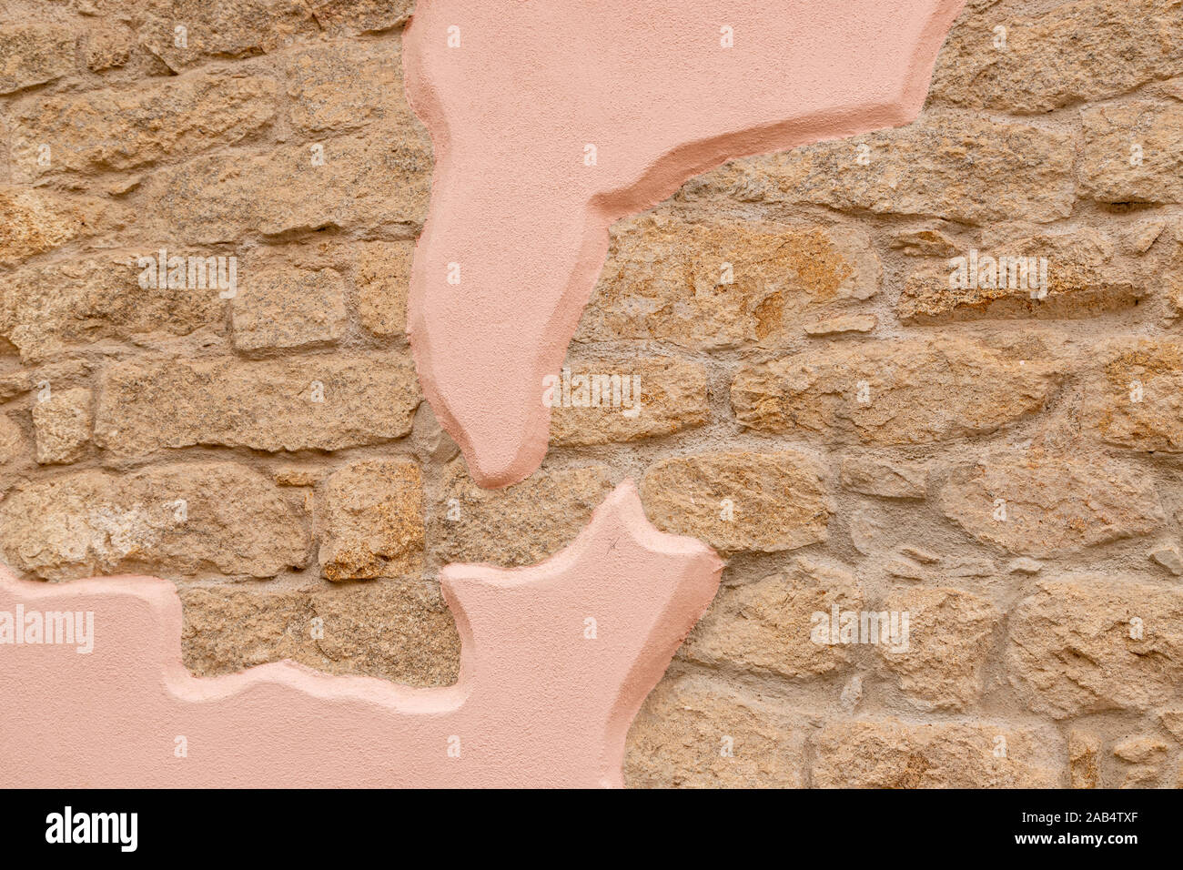 Ancora la vita di un muro di mattoni con modelli di pietra in un colore rosa, La Maddalena, città della Maddalena, Sardegna, Italia Foto Stock