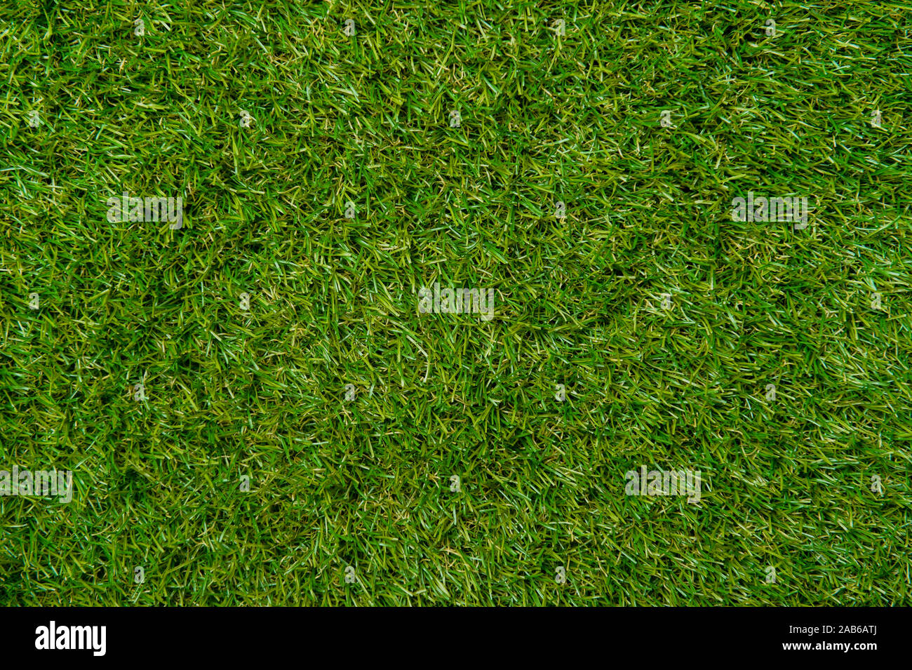 Parete Verde e sfondo verde di erba artificiale progettato per gli sport all'aperto. Foto Stock