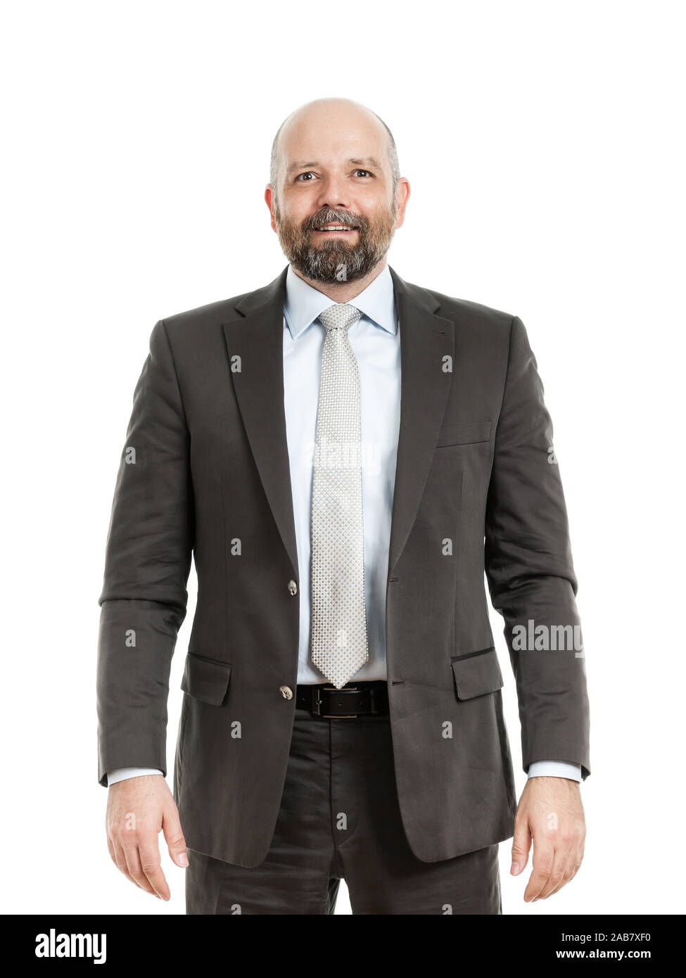 Ein tuechtiger Geschaeftsmann im Anzug vor weissem Hintergrund Foto Stock