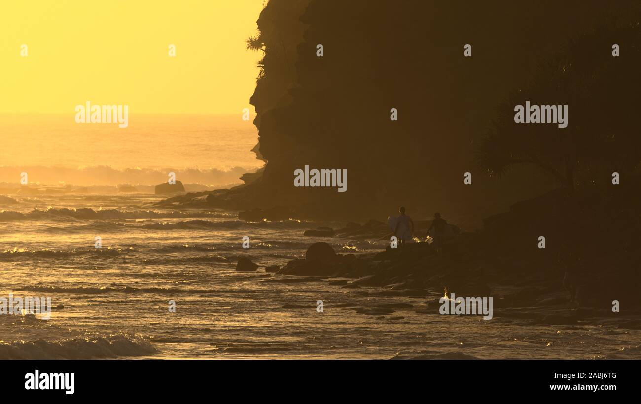 Surfers di sunrise Foto Stock