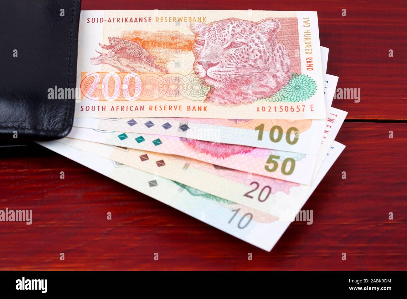 Old South African soldi- Rand nel portafoglio nero Foto Stock
