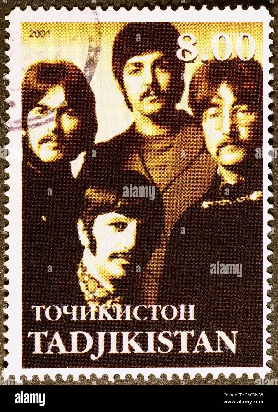 I Fab Four sul francobollo del Tagikistan Foto Stock