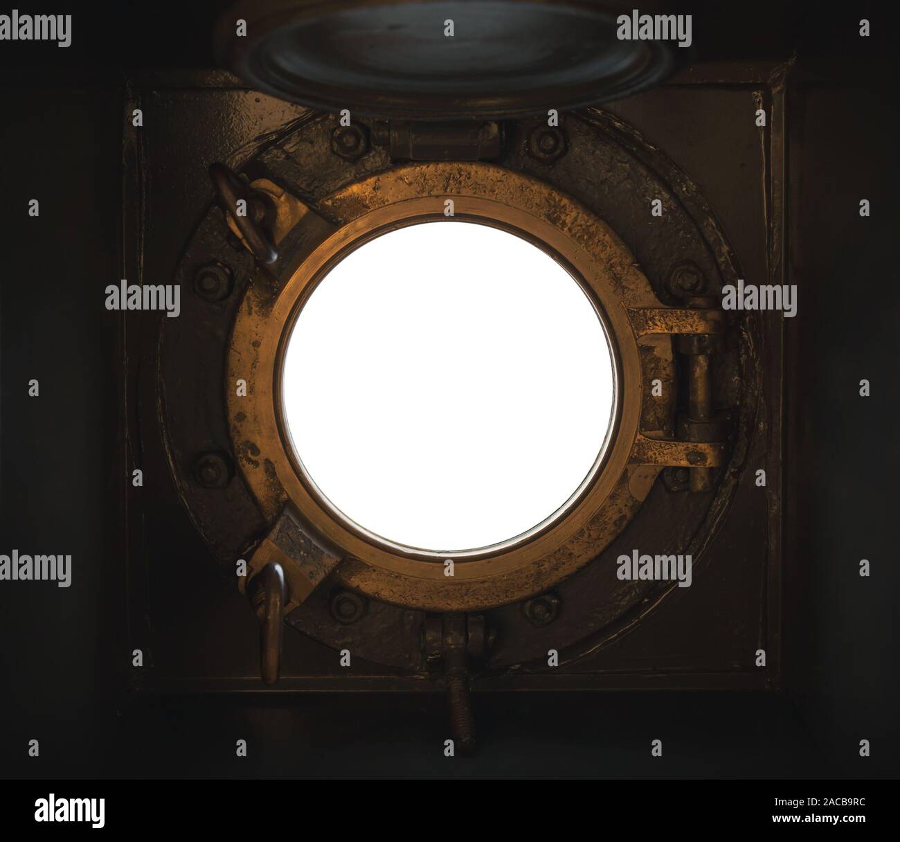 Aprire oblò rotondo nel telaio di ottone con il bianco spazio vuoto al di fuori, quadrato texture di sfondo Foto Stock