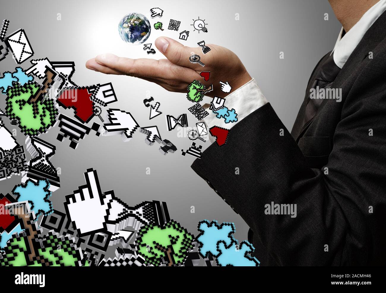 Mano trattiene la terra e icone del computer Foto Stock
