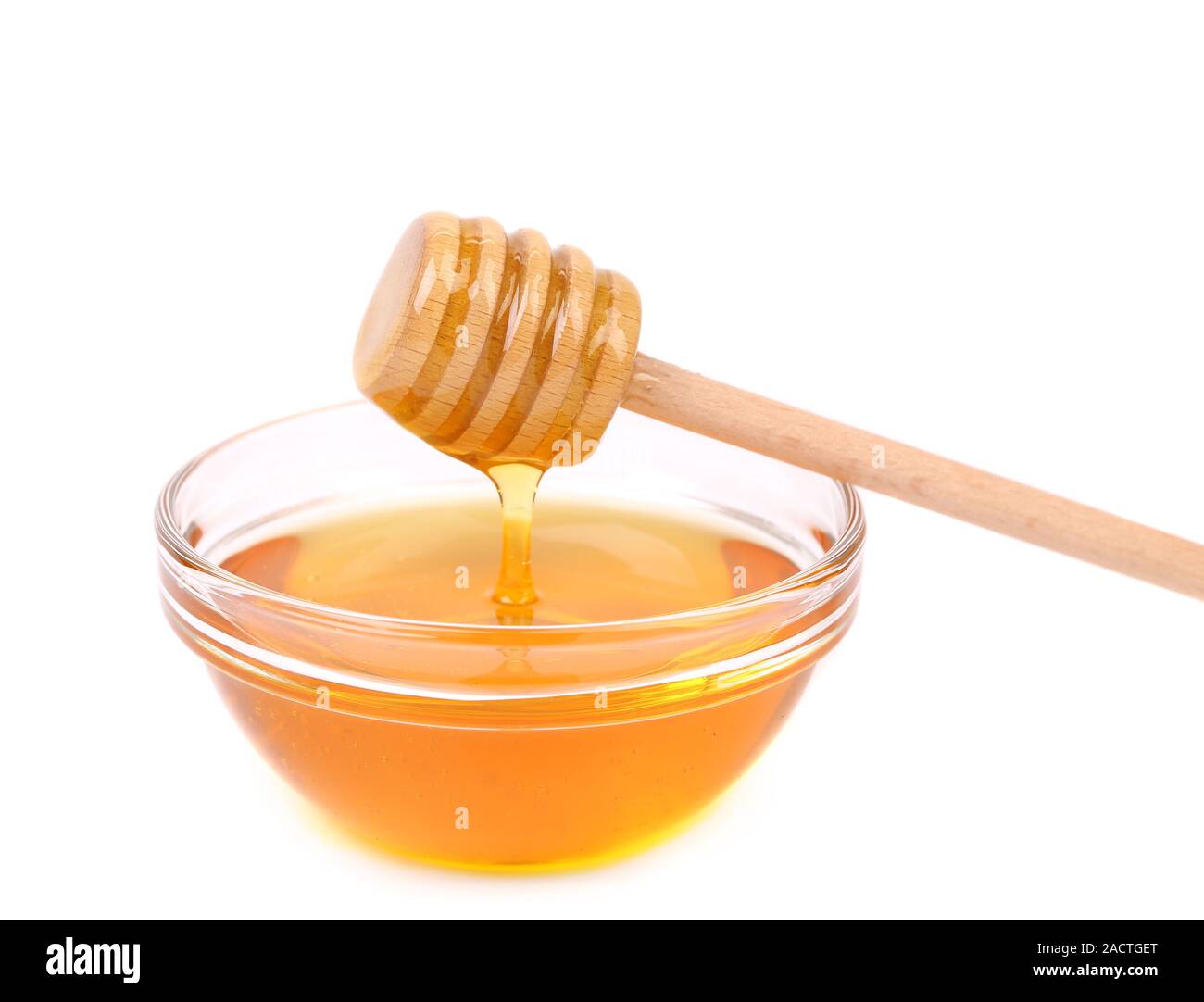 Prua di miele e il cucchiaio di legno. Foto Stock