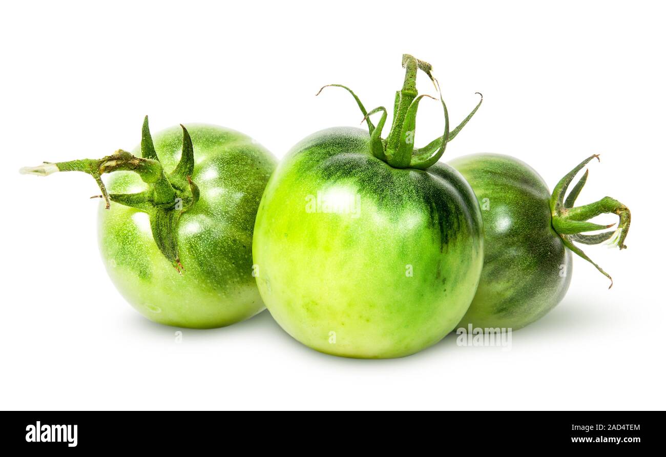Di fronte tre pomodori verdi vicino Foto Stock