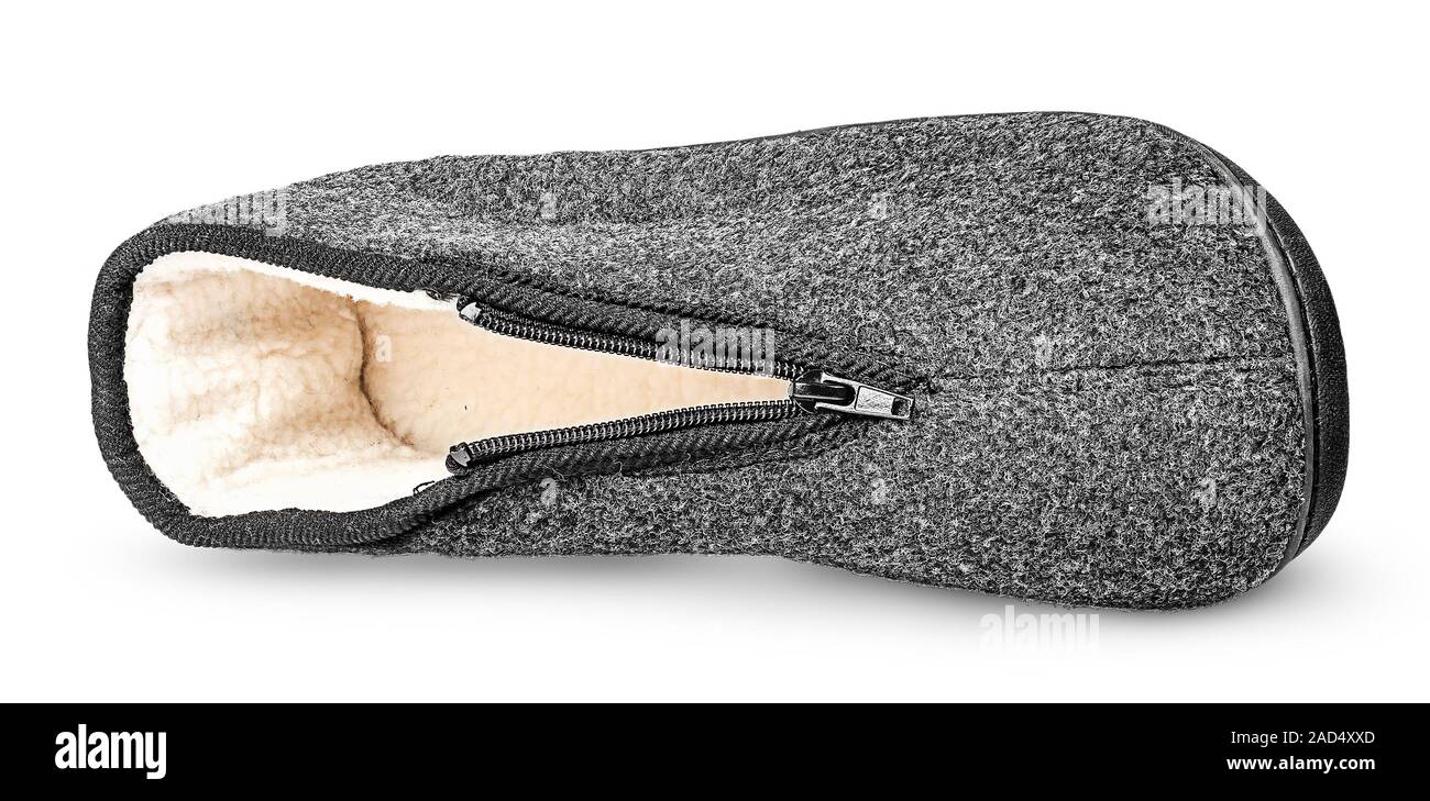 Un unico pezzo le confortevoli grigio scuro pantofola giacente sul lato Foto Stock