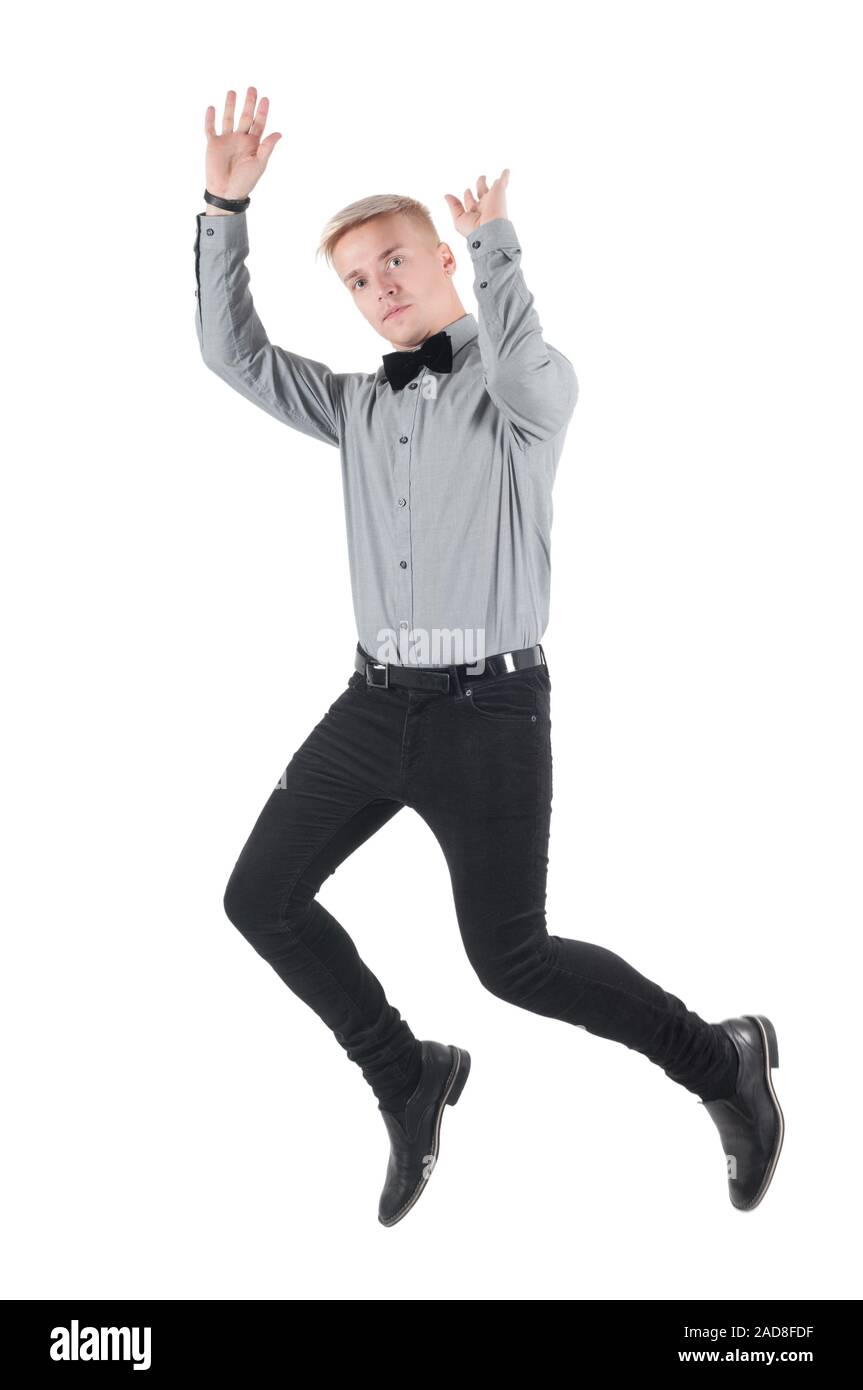 Bel Uomo in camicia e bow tie-jumping, isolato Foto Stock