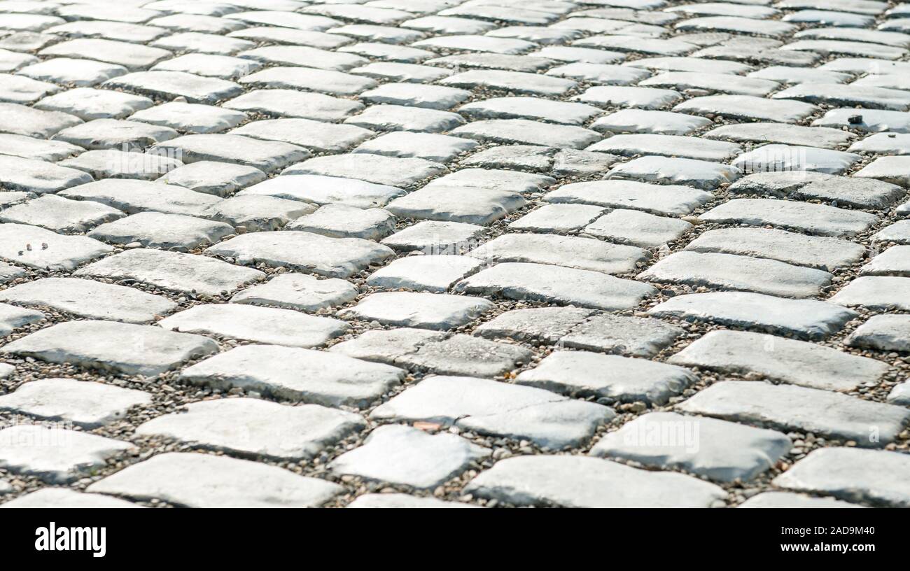 Strada pavimentata con ciottoli per il tuo sfondo Foto Stock