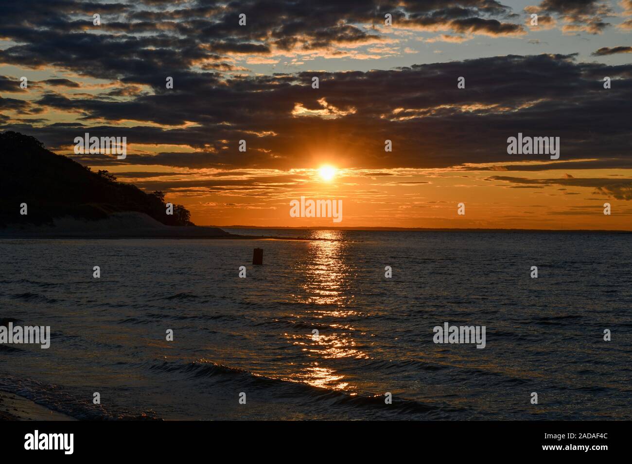 Tramonto lungo la spiaggia al punto Towd in Southampton, Long Island, New York. Foto Stock