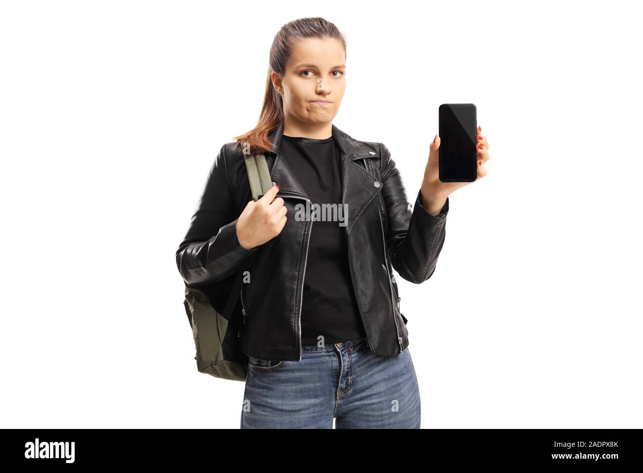 Deluso studentessa che mostra un telefono cellulare isolato su sfondo bianco Foto Stock