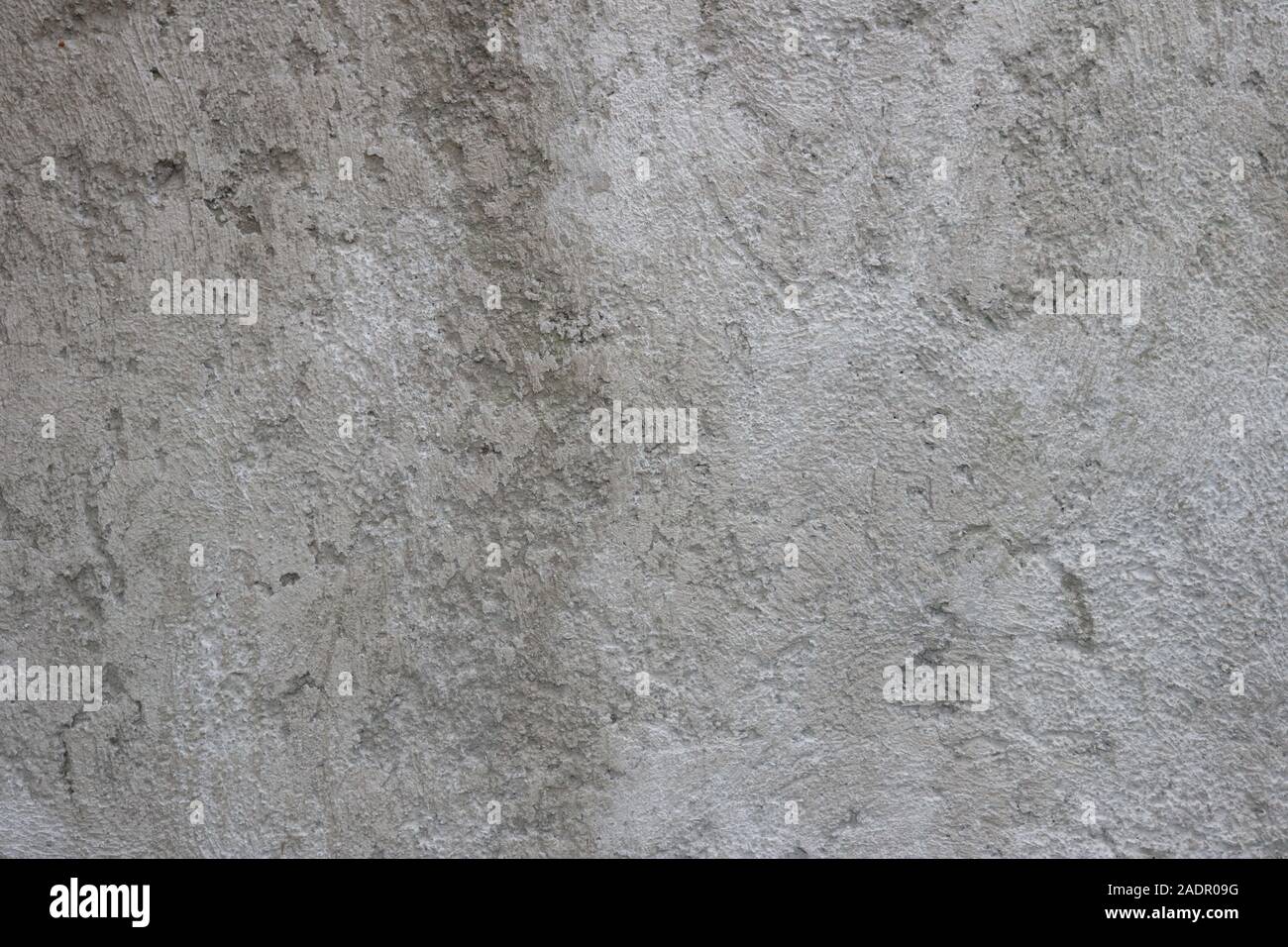 Vecchio muro di cemento grigio testurizzato Foto Stock