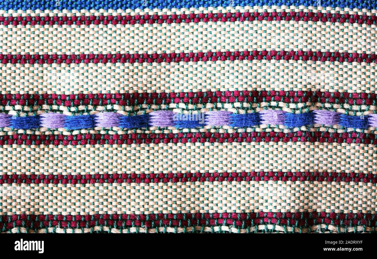 Panno luminoso dello sfondo. Primo piano della tradizionale Medio Oriente tessuto Foto Stock
