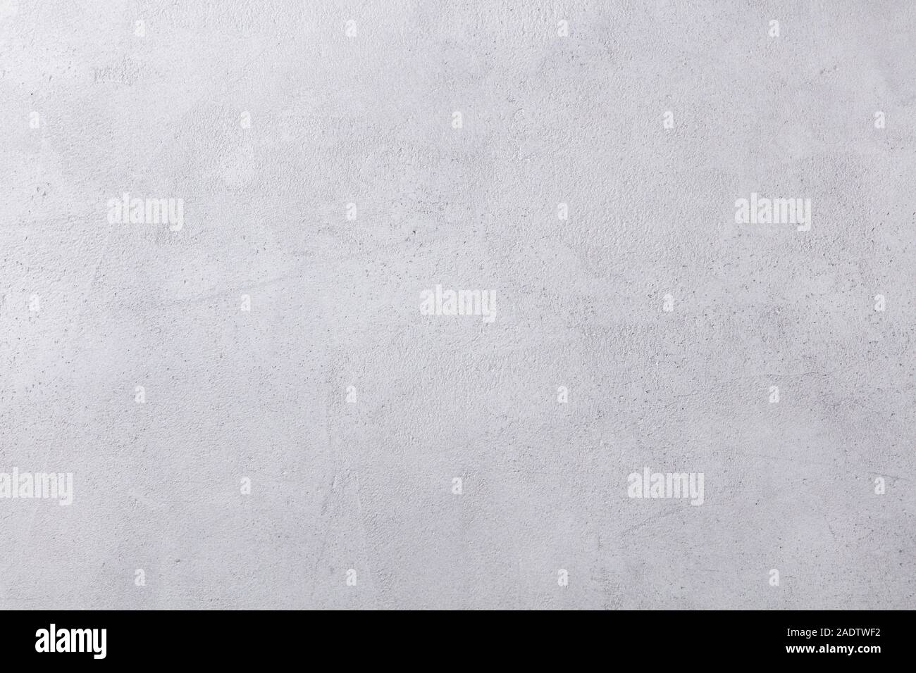Pietra grigia sullo sfondo di calcestruzzo. Vista dall'alto. Spazio di copia Foto Stock