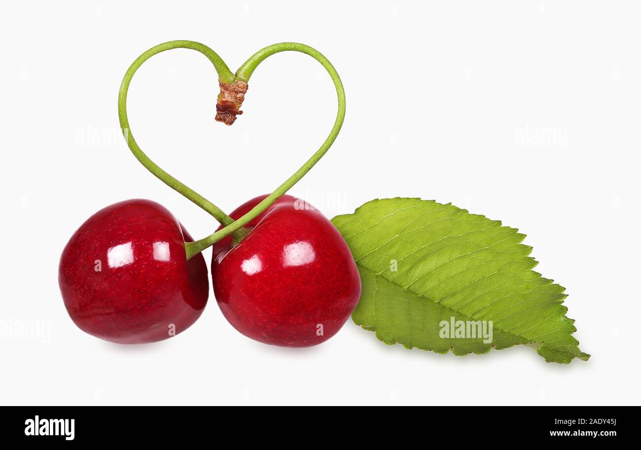 Croccante, ciliegie dolci con il simbolo del cuore Foto Stock