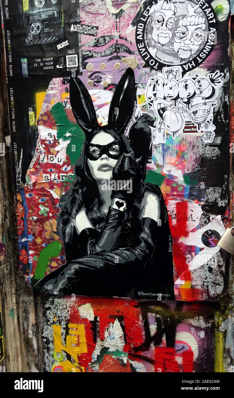 Cat Woman stencil, graffiti, Shoreditch, East End, londra, Inghilterra, Regno Unito Foto Stock