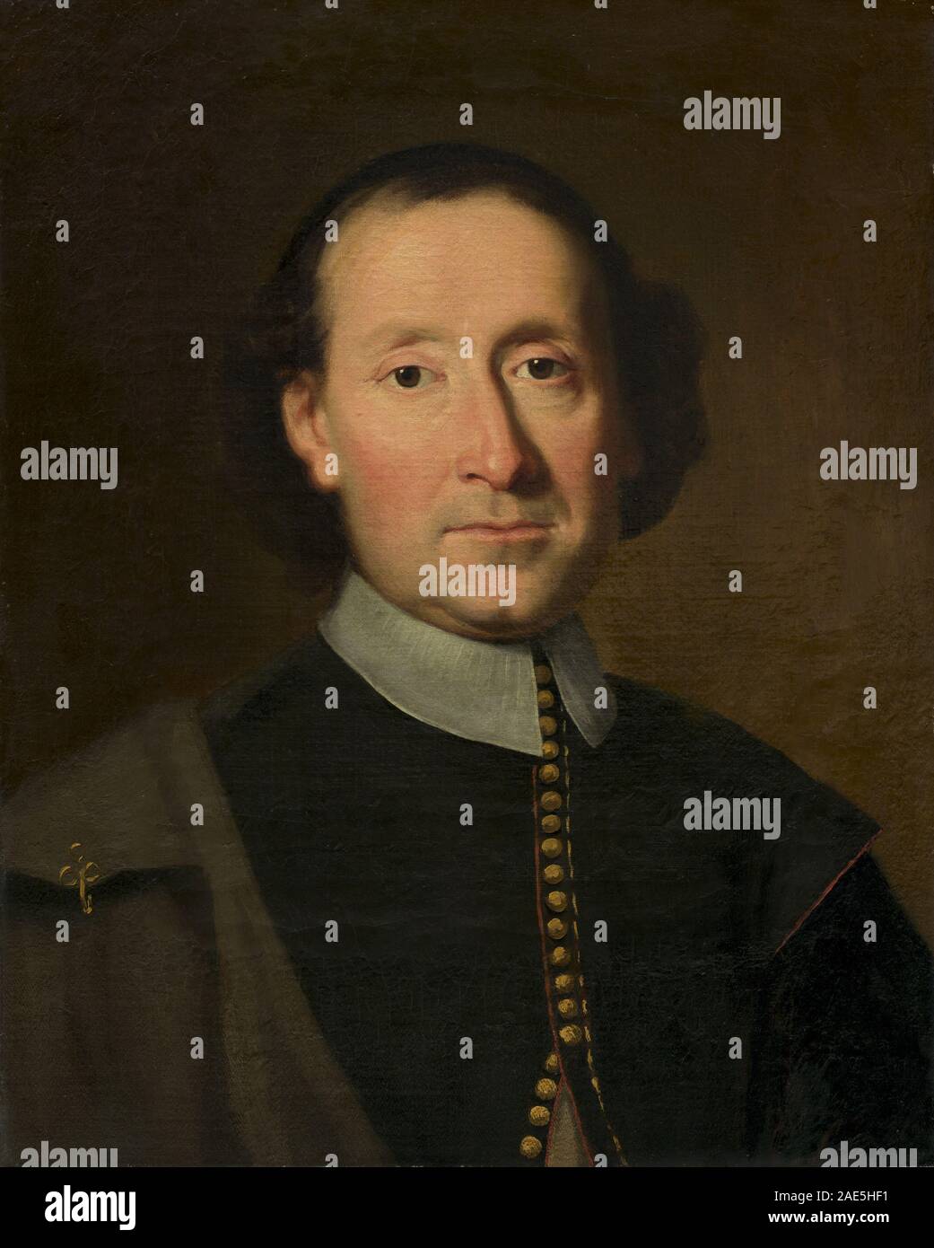 Questo dipinto francese della metà del XVII secolo ritrae un uomo, sottolineando le caratteristiche facciali, l'abbigliamento e lo stile artistico barocco. Foto Stock