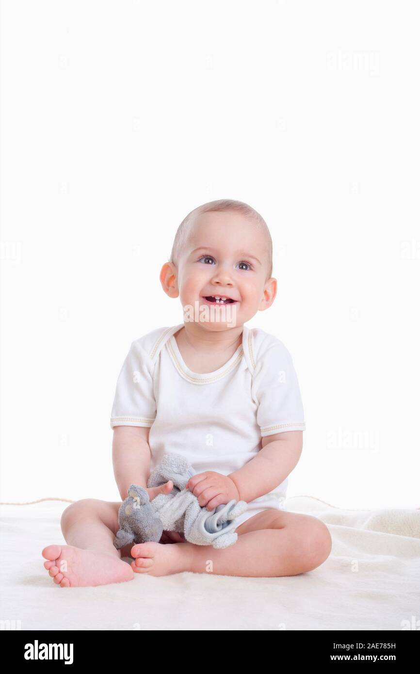 Ritratto di sweet little baby boy - isolato su bianco Foto Stock