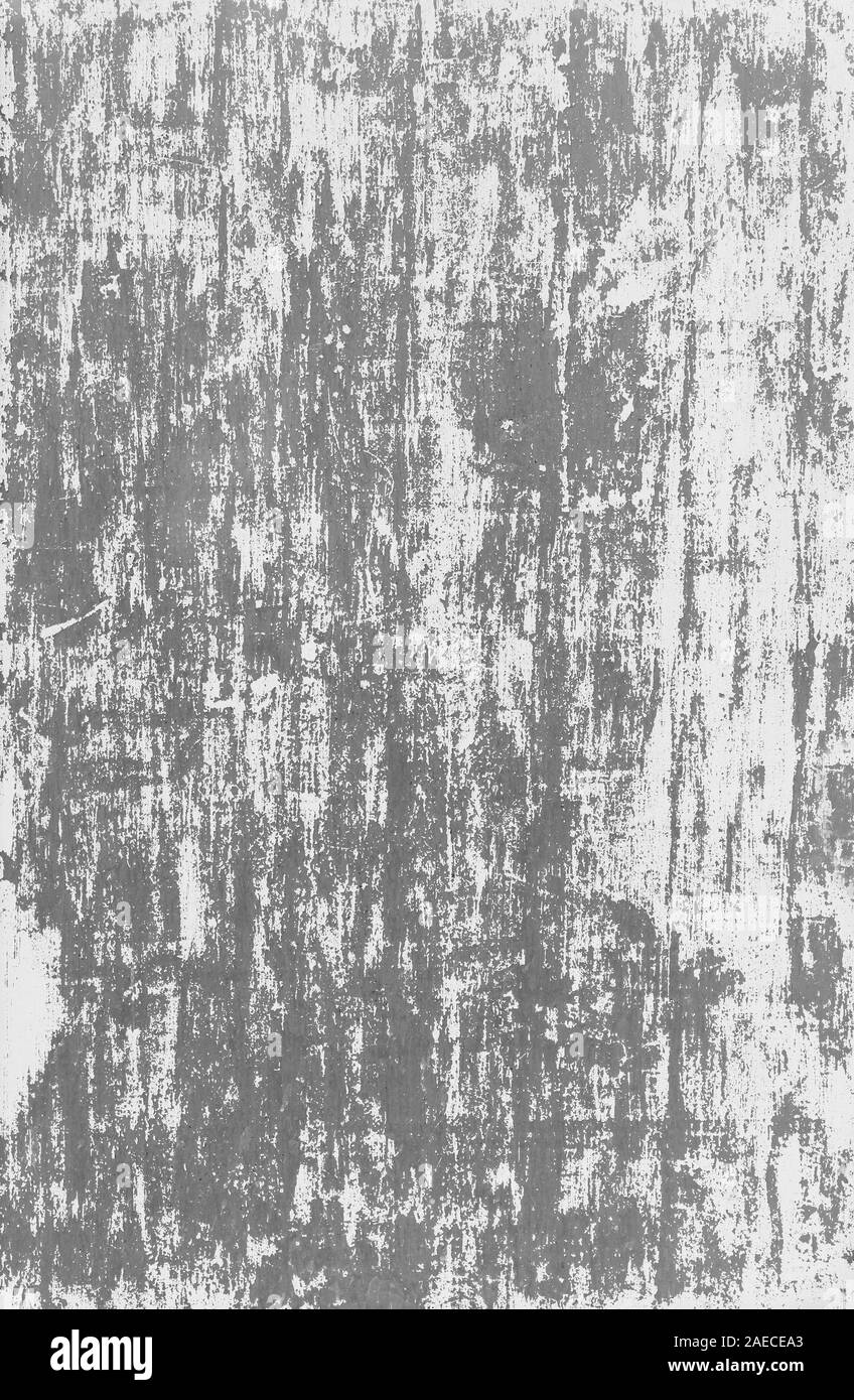 Close-up di un muro grigio con vernice bianca graffiato e distaccata in bianco e nero. Alta risoluzione full frame sfondo astratto. Spazio di copia Foto Stock